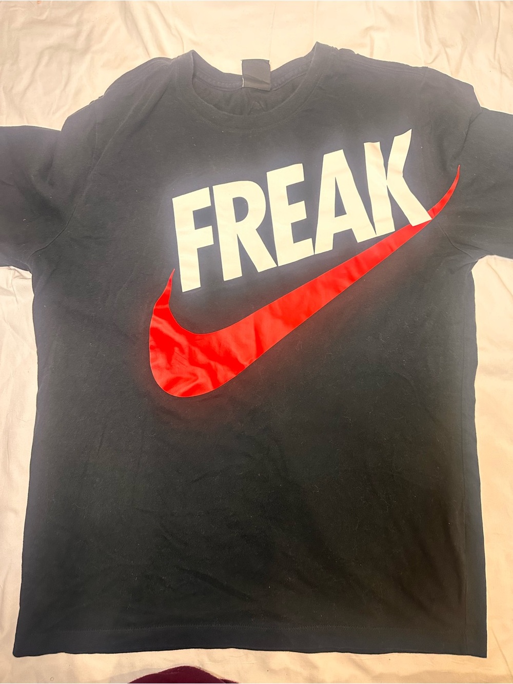 Nike Black Tee with White FREAK Text and Red Swoosh
